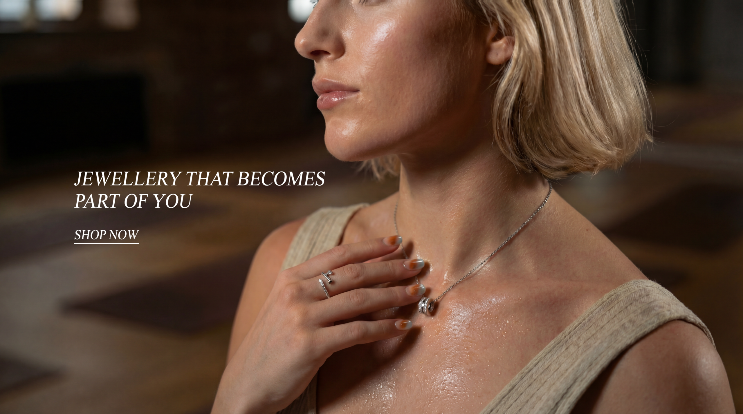 Model styling waterproof everyday jewellery, including gold necklaces and rings by Solisita